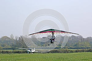 Ultralight airplane taking off from a farm strip