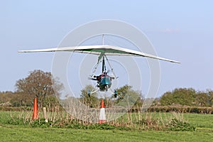 Ultralight airplane taking off from a grass strip