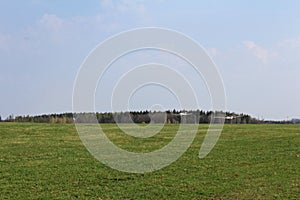 Ultralight plane pull glider to sky with forest in background