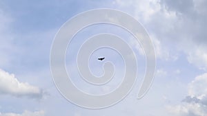 Ultralight small propeller-driven private jet flying in the sky with clouds over the airfield. Rear view of a turboprop aircraft t