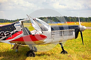 Ultralight weight plane on a grass field
