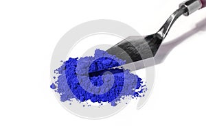 ultramarine pigment, dry paint on a white background, macro