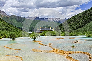 Ultramarine water in the travertine pools of the reserve