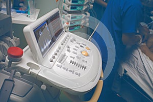 Ultrasonic device and medical workers during diagnostic examination to the critical patient in the ICU