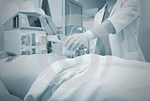 Ultrasonic examination in the hospital, monochrome background