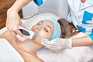 Ultrasonic face cleaning, peeling, in a beauty salon