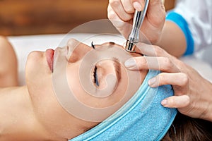 Ultrasonic face cleaning, peeling, in a beauty salon