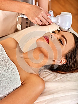 Ultrasonic facial treatment on ultrasound face machine.