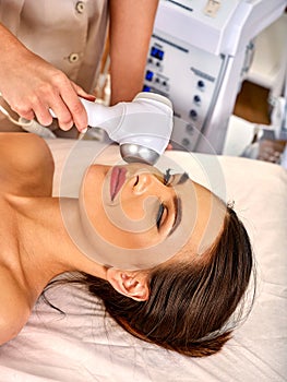 Ultrasonic facial treatment on ultrasound face machine.