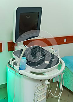 Ultrasound device for testing sonogram. Clinic interior. Sonography. Health tests concept. Closeup