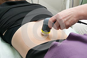 Ultrasound and electrotherapy in clinic. photo