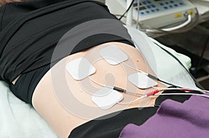 Ultrasound and electrotherapy treatment for a young woman