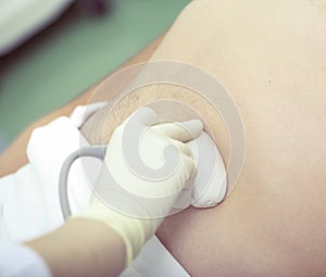 Ultrasound examination of patient performing by physician