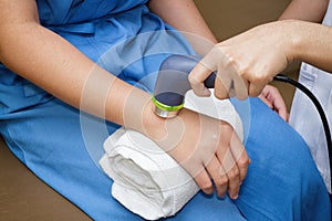 Ultrasound in physical therapy - Therapist using ultrasound to t photo