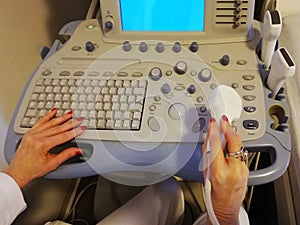 Ultrasound scanner in the hands of a doctor