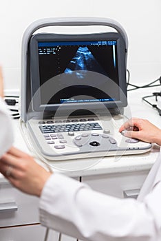 Ultrasound scanner in the hands of a doctor. Diagnostical Sonography clinic.