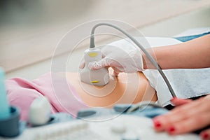 Ultrasound scanner in the hands of a doctor. Diagnostics. Sonography