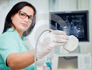 Ultrasound scanner in the hands of a doctor. Diagnostics. Sonography