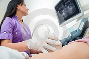 Ultrasound scanner in the hands of a doctor. Diagnostics. Sonography