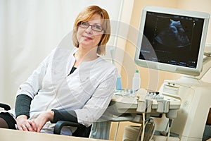 Ultrasound test. Pregnancy. Gynecologist checking fetal life with scanner. photo