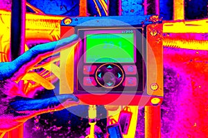 Ultraviolet or electromagnetic view. The industrial control panel shows parametres