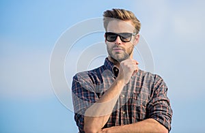 Ultraviolet protection concept. Man eyewear model outdoors blue sky background. Perfect vision. See it clear. Handsome