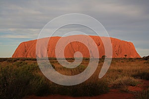 uluru ayers-rock at cloudy sunset