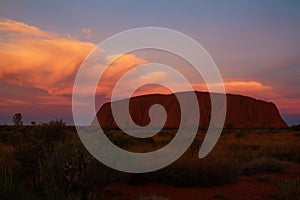 uluru ayers-rock at cloudy sunset