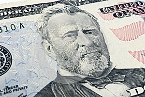 Ulysses S. Grant face on US fifty or 50 dollars bill macro, united states money closeup. Heap of 50 hundred dollar bills on money