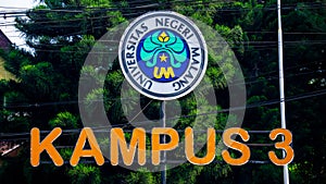 UM campus logo (state university of Malang) with tree background
