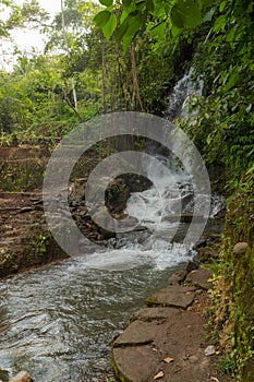 Uma Anyar waterfall, Bali, Indonesia. Jungle, forest, daytime with cloudy sky