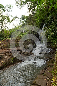 Uma Anyar waterfall, Bali, Indonesia. Jungle, forest, daytime with cloudy sky