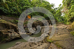 Uma Anyar waterfall, Bali, Indonesia. Jungle, forest, daytime with cloudy sky