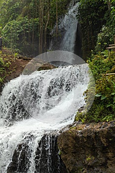 Uma Anyar waterfall, Bali, Indonesia. Jungle, forest, daytime with cloudy sky