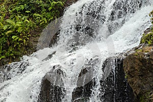 Uma Anyar waterfall, Bali, Indonesia. Jungle, forest, daytime with cloudy sky photo