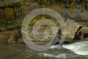 Uma Anyar waterfall, Bali, Indonesia. Jungle, forest, daytime with cloudy sky photo