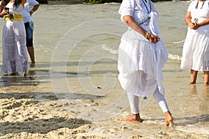 Umbanda supporters are seen dancing during a tribute to iemanja on Itapema beach in the city of Santo Amaro, Bahia