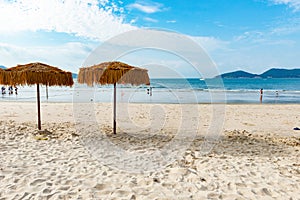 Two umbrellas on a beach