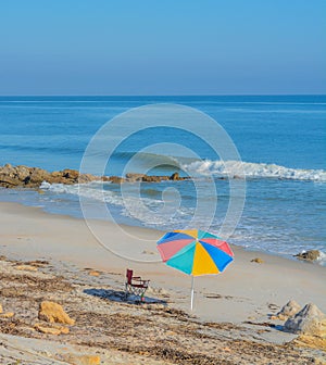 A Umbrella on the beach  of the Atlantic Ocean, at Marineland Beach in Marineland, Flagler County, Florida photo