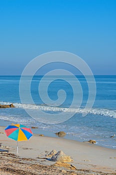 A Umbrella on the beach of the Atlantic Ocean, at Marineland Beach in Marineland, Flagler County, Florida photo