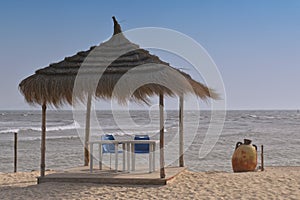 Umbrella, blue sky, sun. Tunisia, island Djerba.