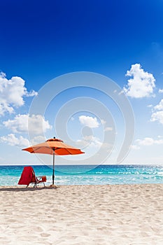 Umbrella and chair on the beach