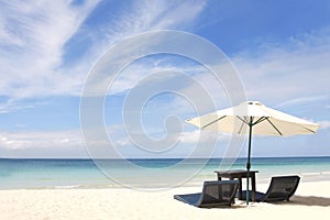 Umbrella and chairs on beach