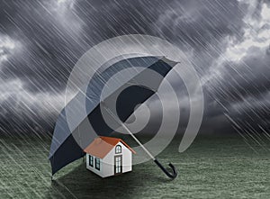 Umbrella covering home under heavy rain photo