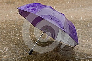 Umbrella at intense rainy weather