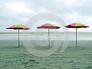 Umbrella at kuakata beach, Bangladesh photo