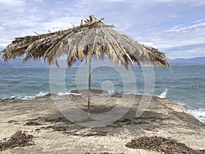 Umbrella next to sea shore