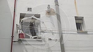 Umbrella resting on the clothes lines in the courtyard photo