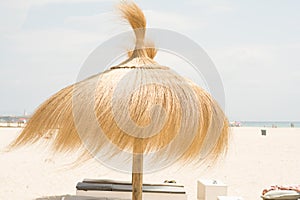 Umbrella for shade at the beach in windy day photo