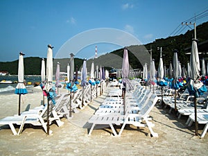 Umbrellas and beach chairs on Koh Larn. PATTAYA, Thailand